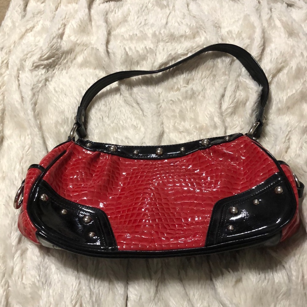 Kathy Van Zeeland red purse